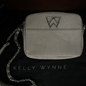 Silver and blue Kelly Wynne shoulder bag with dust cover